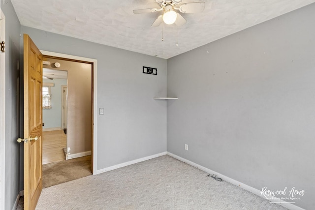 511 N Cleveland Ave, Bradley, IL 60915 - unfurnished room featuring baseboards, a ceiling fan, and carpet flooring