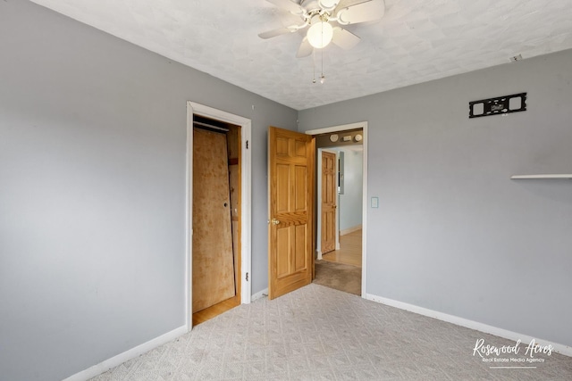 511 N Cleveland Ave, Bradley, IL 60915 - unfurnished bedroom with ceiling fan, baseboards, and carpet floors