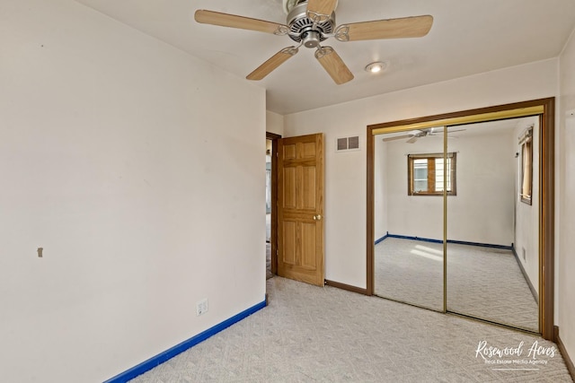 511 N Cleveland Ave, Bradley, IL 60915 - unfurnished bedroom with a ceiling fan, a closet, carpet, baseboards, and visible vents