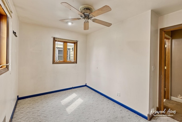 511 N Cleveland Ave, Bradley, IL 60915 - empty room featuring baseboards, light colored carpet, and ceiling fan