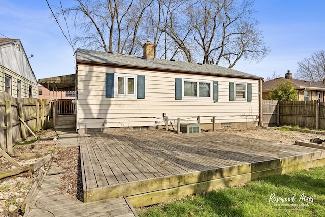 511 N Cleveland Ave, Bradley, IL 60915 - rear view of property featuring a wooden deck, a fenced backyard, a chimney, and crawl space