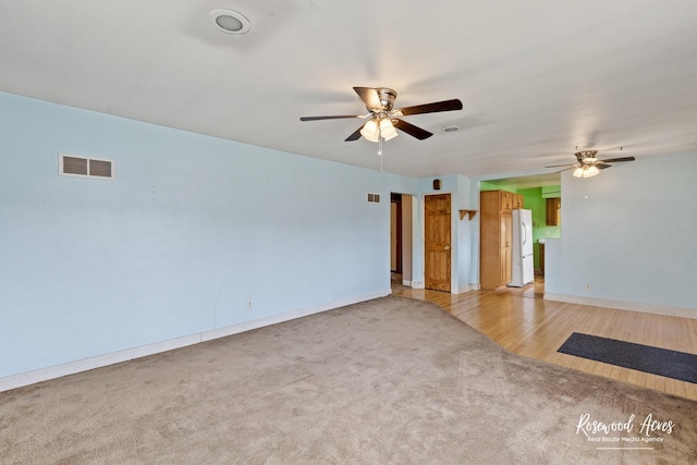 511 N Cleveland Ave, Bradley, IL 60915 - empty room featuring ceiling fan, light carpet, visible vents, and baseboards