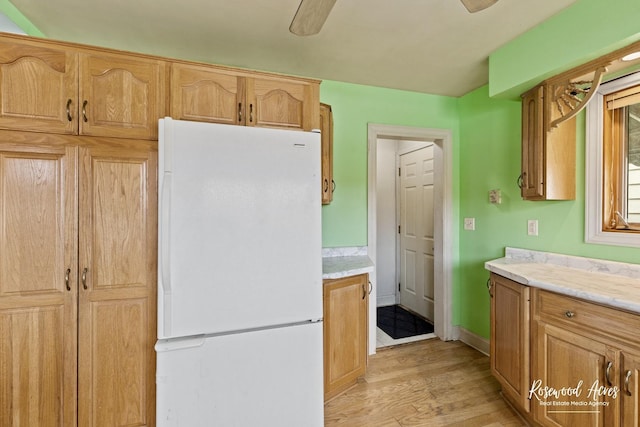 511 N Cleveland Ave, Bradley, IL 60915 - kitchen with light wood-type flooring, freestanding refrigerator, and ceiling fan