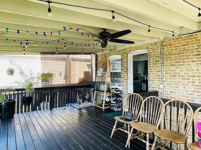 wooden deck featuring a ceiling fan