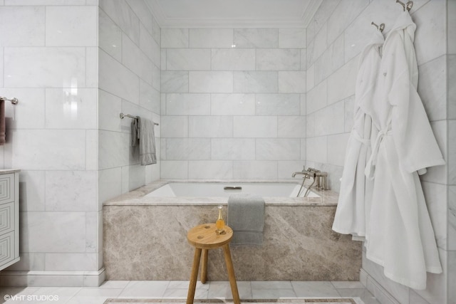 bathroom featuring a garden tub, crown molding, tile patterned flooring, and tile walls