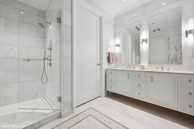 bathroom with crown molding, a sink, double vanity, and a stall shower