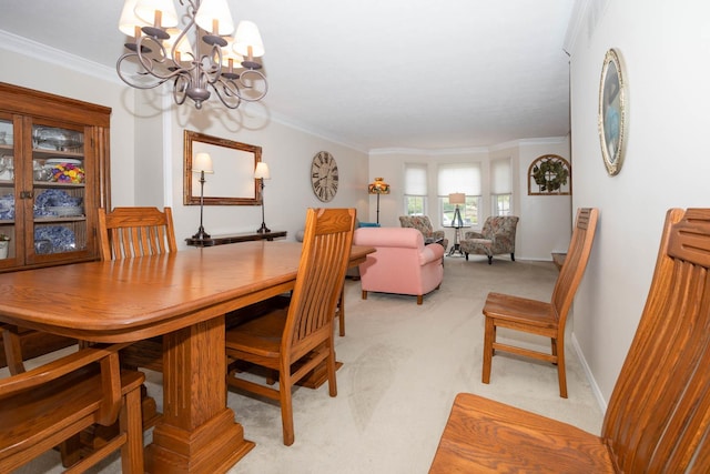 dining area featuring a chandelier, light carpet, and ornamental molding