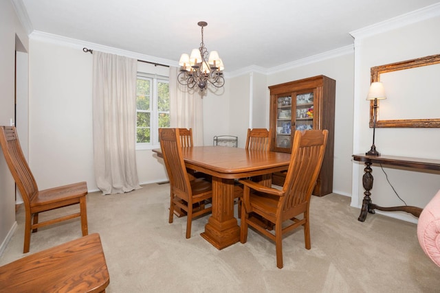 dining space with an inviting chandelier, ornamental molding, and light colored carpet