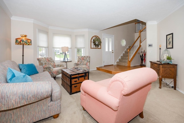 living area featuring ornamental molding, plenty of natural light, light colored carpet, and stairway