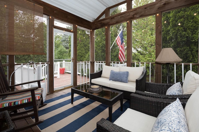 sunroom with an outdoor living space