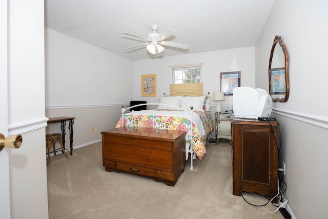 bedroom with a ceiling fan and carpet flooring