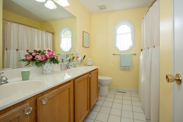 full bathroom with a wealth of natural light, visible vents, and a sink