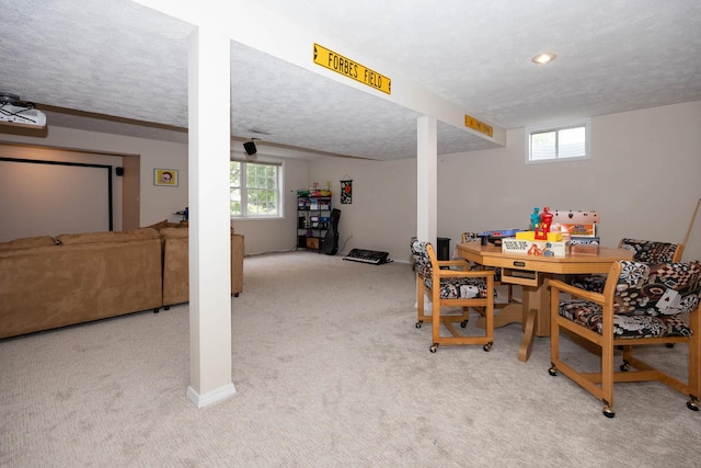 dining room with a textured ceiling and carpet flooring