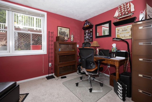 office area featuring carpet flooring and baseboards