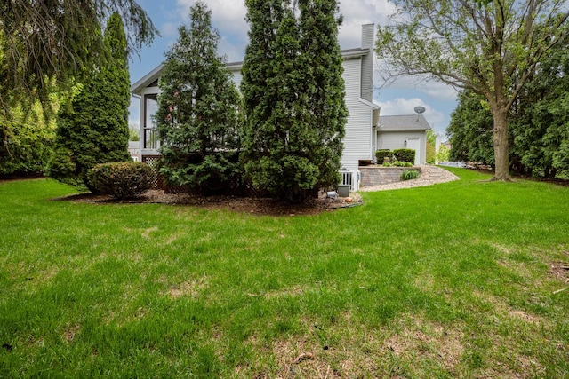 view of yard with a garage