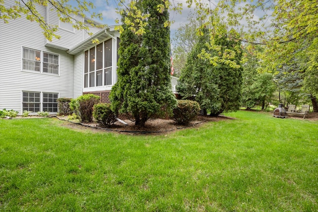 view of yard with a sunroom