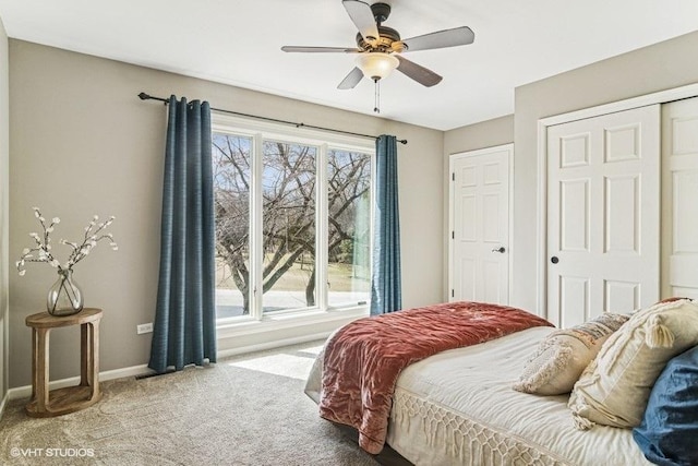 carpeted bedroom featuring baseboards, ceiling fan, and a closet