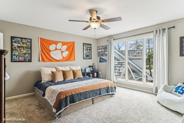 carpeted bedroom with baseboards and ceiling fan