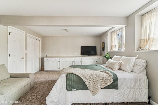 bedroom featuring light colored carpet
