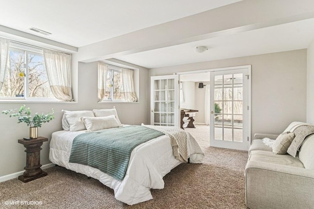 bedroom featuring carpet floors, baseboards, and visible vents