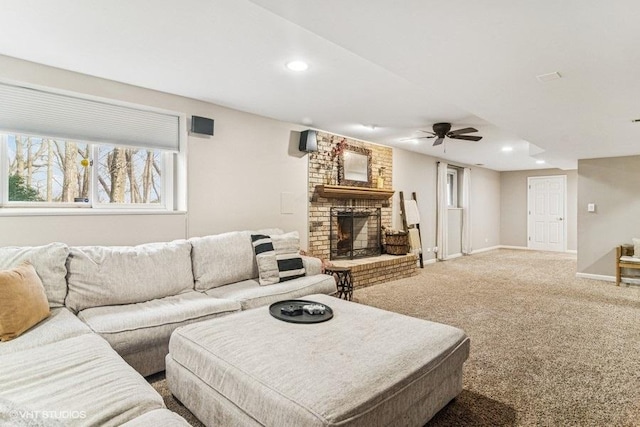 carpeted living room with baseboards, a fireplace, a ceiling fan, and recessed lighting
