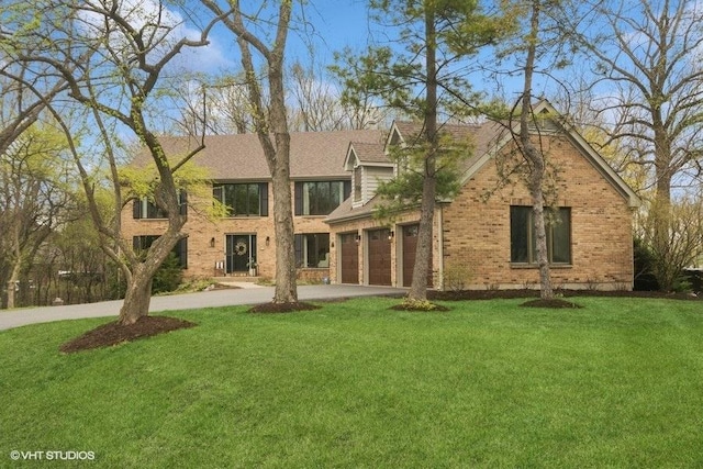 exterior space with brick siding, a yard, and concrete driveway