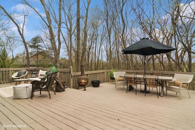 deck featuring outdoor dining area and an outdoor living space