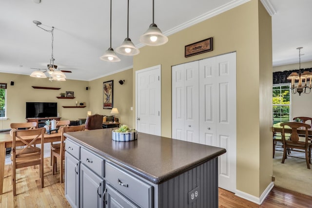 7817 Cascade Way, Gurnee, IL 60031 - kitchen featuring gray cabinetry, dark countertops, ceiling fan, a chandelier, and light wood finished floors