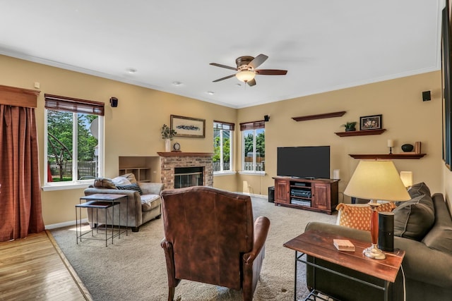 7817 Cascade Way, Gurnee, IL 60031 - living area featuring a ceiling fan, ornamental molding, a brick fireplace, and wood finished floors