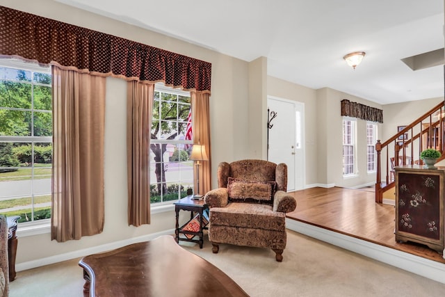7817 Cascade Way, Gurnee, IL 60031 - living area with carpet floors, stairway, and plenty of natural light