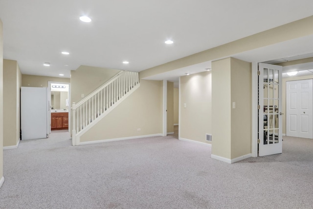 7817 Cascade Way, Gurnee, IL 60031 - finished below grade area featuring light carpet, freestanding refrigerator, recessed lighting, and stairway