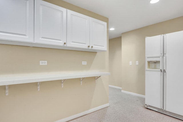 7817 Cascade Way, Gurnee, IL 60031 - kitchen featuring white refrigerator with ice dispenser, white cabinetry, light colored carpet, recessed lighting, and a breakfast bar