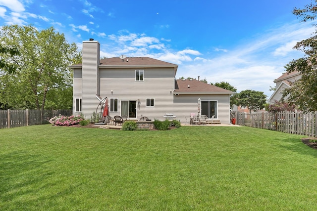 7817 Cascade Way, Gurnee, IL 60031 - back of property with a patio area, a chimney, and a fenced backyard