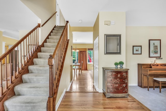 7817 Cascade Way, Gurnee, IL 60031 - stairs with a chandelier and wood finished floors