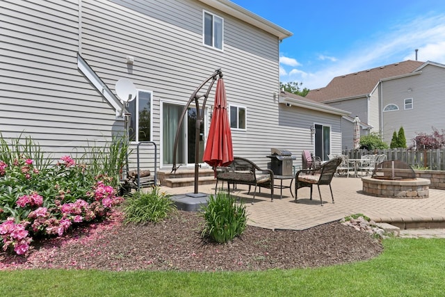 7817 Cascade Way, Gurnee, IL 60031 - rear view of house featuring an outdoor fire pit and a patio area