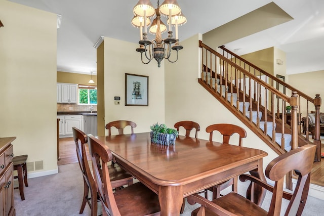 7817 Cascade Way, Gurnee, IL 60031 - dining space featuring a chandelier, stairs, and light colored carpet