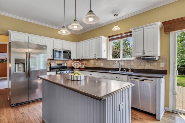 7817 Cascade Way, Gurnee, IL 60031 - kitchen with appliances with stainless steel finishes, dark countertops, light wood finished floors, a center island, and white cabinetry