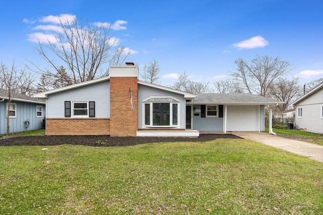 view of front of property featuring a front lawn, driveway, a chimney, a garage, and brick siding