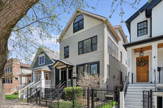 3311 N Hamilton Ave, Chicago, IL 60618 - view of front of house featuring covered porch, a fenced front yard, and a gate