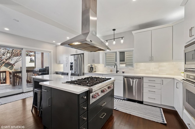 3311 N Hamilton Ave, Chicago, IL 60618 - kitchen featuring white cabinets, a sink, dark cabinetry, stainless steel appliances, and island range hood