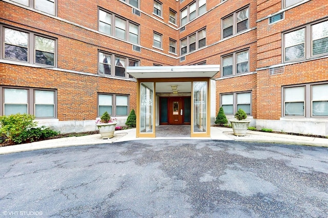 property entrance with brick siding
