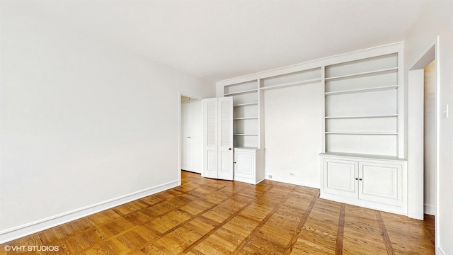 unfurnished bedroom with baseboards