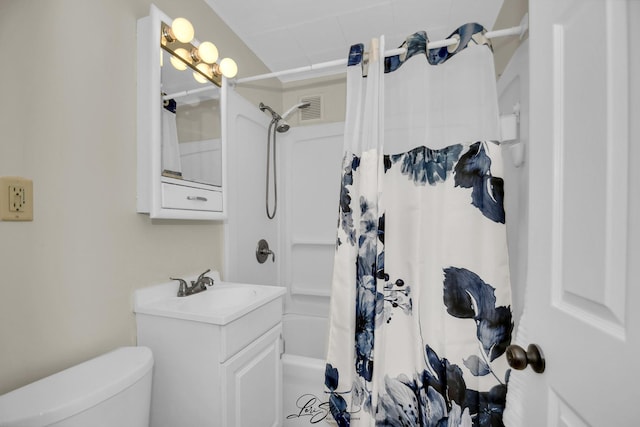full bath with toilet, vanity, and visible vents