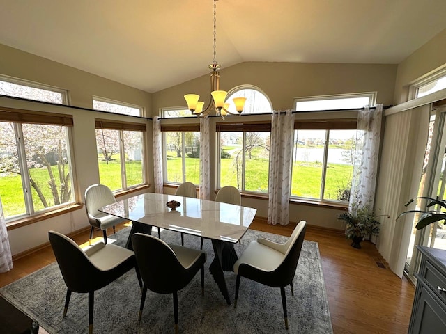 2115 Stafford Ct, Plainfield, IL 60586 - dining space with a notable chandelier, wood finished floors, and plenty of natural light
