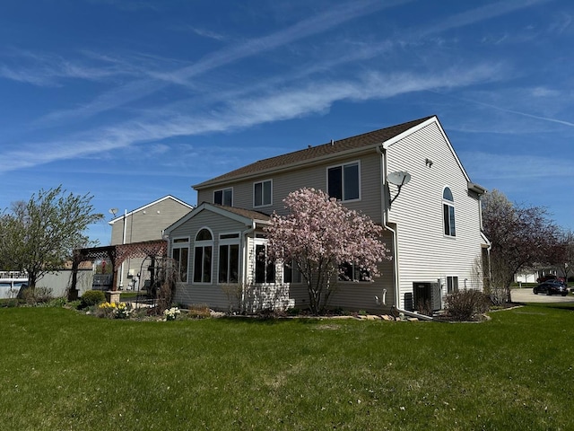 2115 Stafford Ct, Plainfield, IL 60586 - rear view of property featuring a lawn
