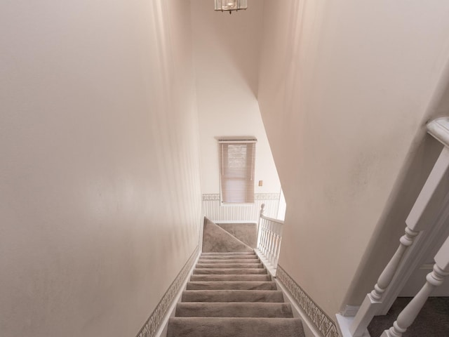 staircase with a towering ceiling