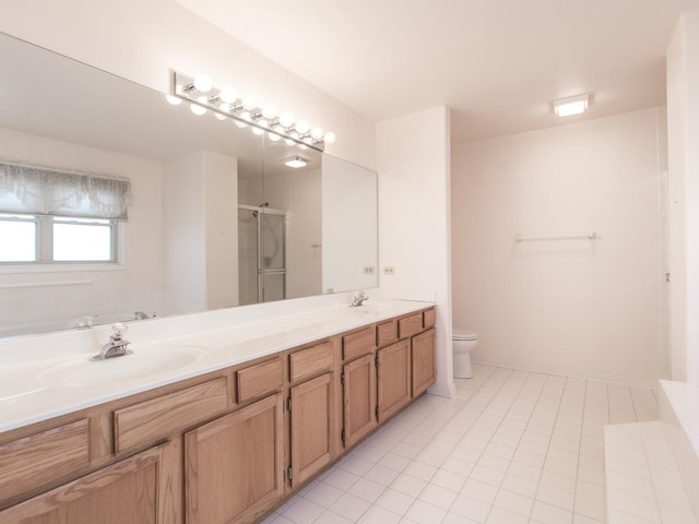 full bath featuring a sink, double vanity, toilet, tile patterned flooring, and a shower stall