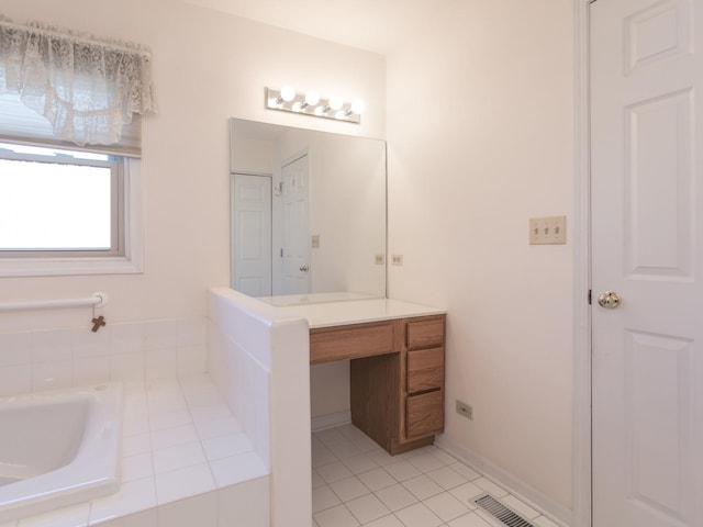 bathroom featuring visible vents, tile patterned floors, and vanity