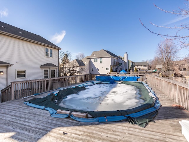 deck featuring a residential view and fence