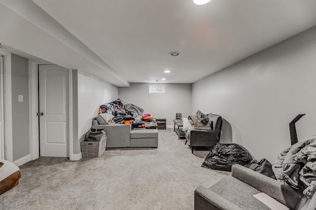 living room with baseboards, recessed lighting, and carpet